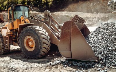 Close up of wheel loader loading gravel and sand materials